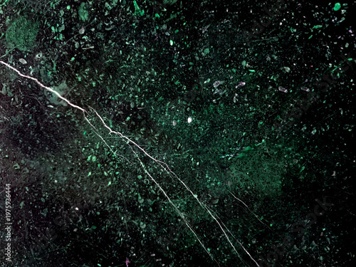 Abstract dark green and black marble texture background with natural white veins and cracked stone surface