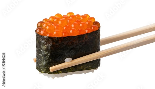 Sushi roll is held by wooden chopsticks for a dining shot.