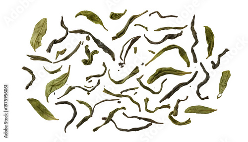 Tea leaves are scattered across a neutral white surface now.