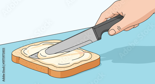 Close up of a human hand using a kitchen knife to spread creamy butter or margarine onto a single slice of toasted white bread for breakfast.