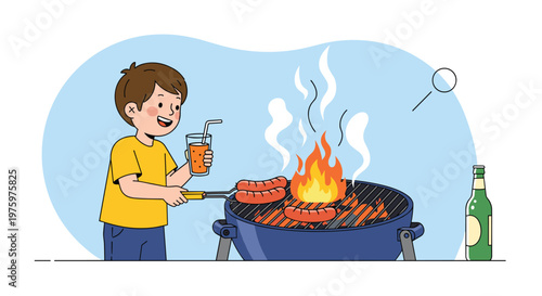 Happy boy in yellow shirt grilling sausages on charcoal barbecue grill while holding glass of orange juice with straw.