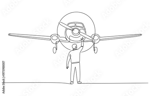 Person inspecting the front of an airplane with landing gear airplane aviation aircraft transport propeller fuselage aeroplane transportation airliner navigation