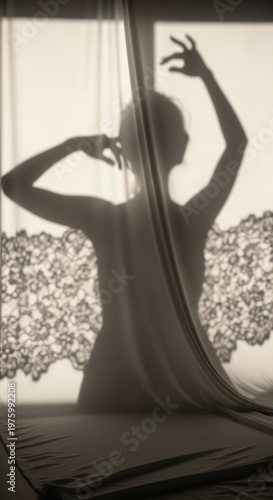 Silhouette of a graceful woman dancing behind a sheer curtain with lace detail