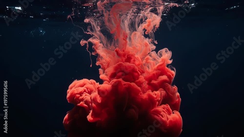 Red Ink Cloud Spreading Underwater Dark Liquid.