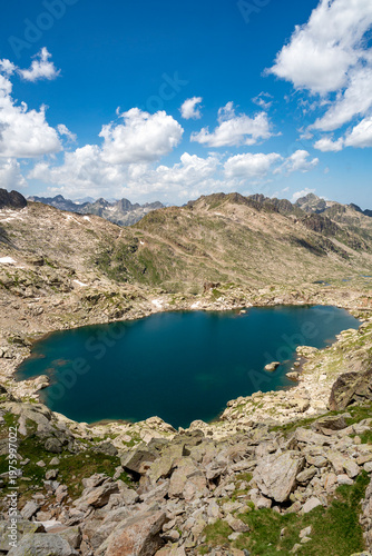 The Estanh Gelat, at  2,588 meters, is a glacial lake located on the western slope of the Circ de Colomers, in Vall d Aran, Lleida province, Catalonia, Spain