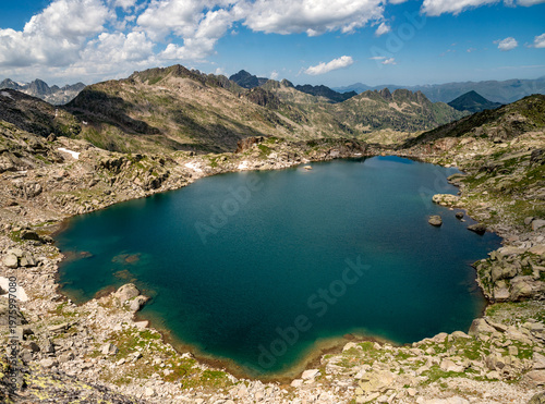 The Estanh Gelat, at  2,588 meters, is a glacial lake located on the western slope of the Circ de Colomers, in Vall d Aran, Lleida province, Catalonia, Spain