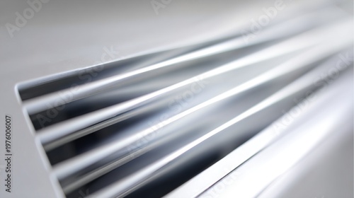 vent. Close-up of a modern silver air conditioner vent, crisp white streams of cool air flowing out. mobility guides, transit brochures, designed for transport & logistics marketing.