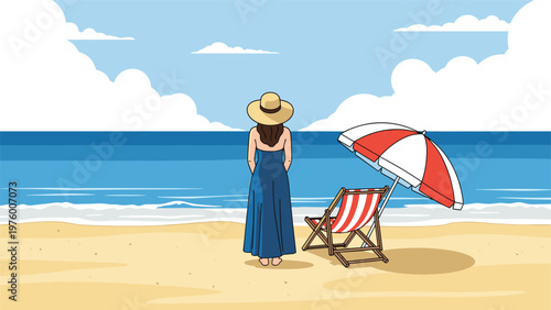Woman wearing a sun hat and blue dress stands on a sandy beach looking at the ocean with a chair and umbrella nearby.