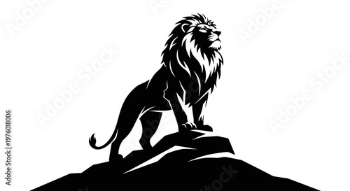 Majestic lion standing proudly on a rock silhouette.