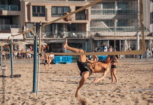Bild auf Leinwand young man playing footvolley in Las Canteras beach