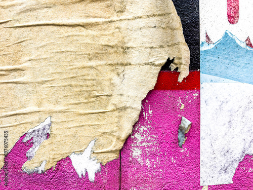 Layers of old colorful posters on wall damaged by time for your grunge style design