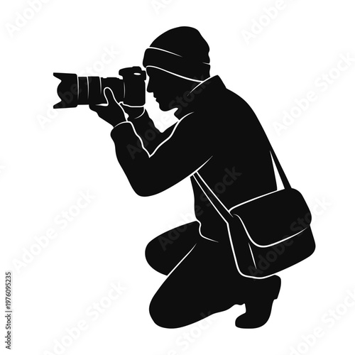 A vector silhouette of a photographer kneeling while capturing a moment.