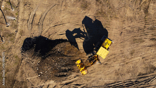 Aerial View of a Yellow Front Loader Working at an Excavation Site