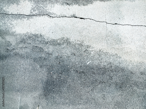 Texture of concrete with a longitudinal crack.