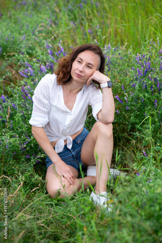 Woman Sitting in Lavender Field