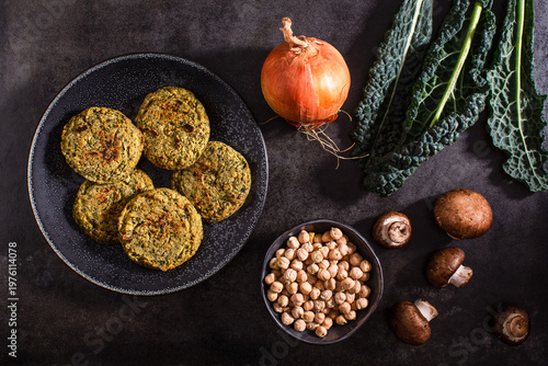 Raw vegetables on textured dark surface
