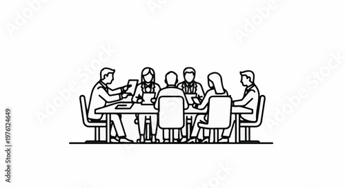 Group meeting around a table, discussing work and projects