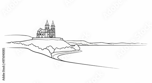Ornate church structure perched atop a hill overlooking a serene body of water