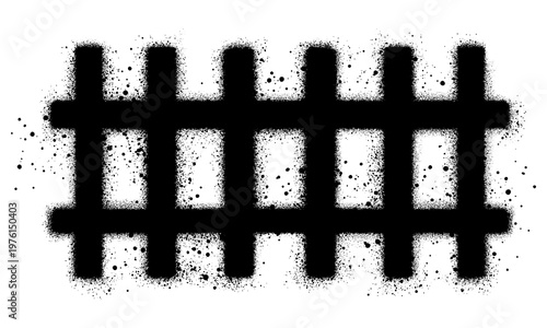 Wooden fence in graffiti style with black spray paint.