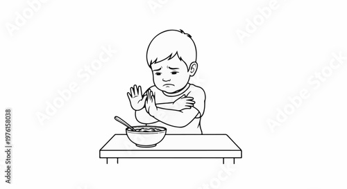 Sad child refuses to eat from bowl with spoon on table