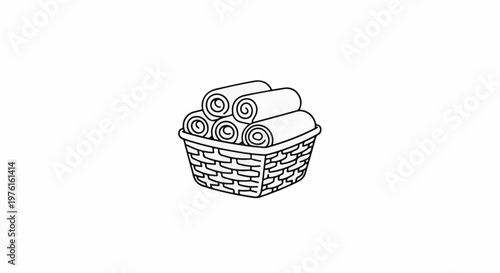 Rolled towels neatly stacked in a woven basket