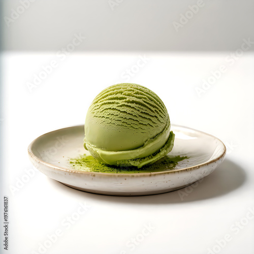 A green ice cream on a white plate