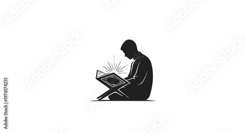Silhouette of a person reading a holy book bathed in light