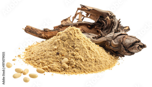 A pile of ground, light-brown substance sits beside a weathered piece of wood, with a small scattering of seeds
