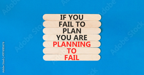 Planning to fail symbol. Concept words If you fail to plan you are planning to fail on beautiful wooden sticks. Beautiful blue paper background. Business planning to fail concept. Copy space.