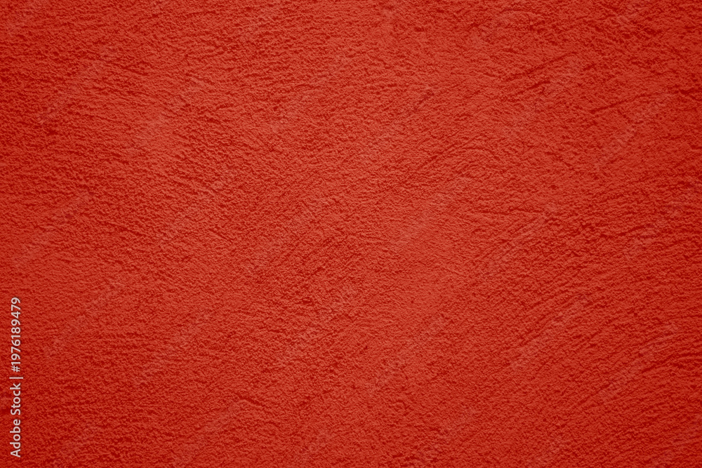 Fototapeta premium red scarlet plaster wall texture. Seamless surface abstract solid background Pale painted wall built structure textured stucco in terracotta color. seamless texture of plaster backdrop pattern
