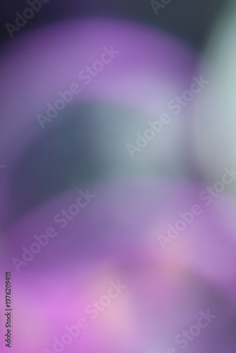 Modern purple abstract background with vibrant bokeh glow and wavy light motion