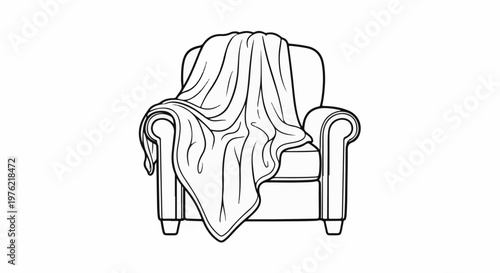 Cozy armchair draped with a soft, textured throw blanket, perfect for relaxation