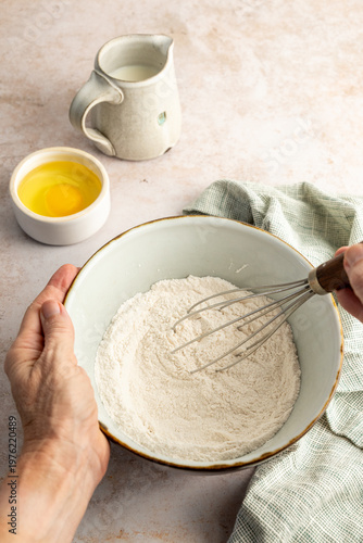 Pancake ingredients in a bowl being mixed 