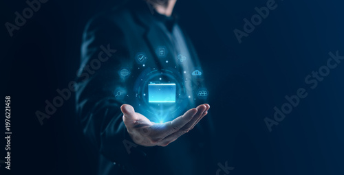 Businessman presenting a glowing digital folder interface symbolizing cloud storage, data management, and secure information systems in a modern technology environment with virtual network elements.