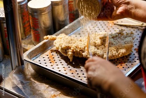 Wallpaper Mural At a stall, the vendor sells crispy deep-fried chicken cutlets with spice and salt, one of local people's favorite street-foods, in Raohe Street Night Market, Taipei, where tasty snacks can be savored Torontodigital.ca