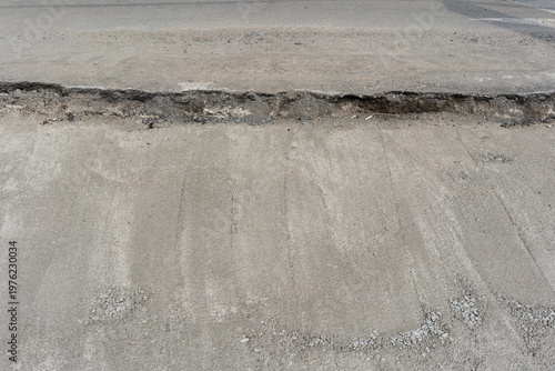 Wallpaper Mural Eroded Road Edge With Exposed Substrate And Layered Base, Uneven Shoulder Creating Vehicle Hazard And Dropoff, Granular Foundation Visible After Asphalt Removal, Municipal Repair Context With Focus Torontodigital.ca