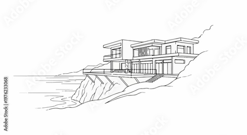 Modern multi-story house perched on a cliff overlooking the ocean
