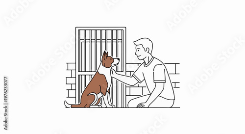 Man kneels, petting a dog in front of a brick wall and metal bars