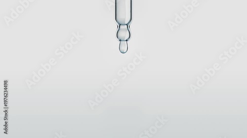 Macro shot of a crystal clear serum drop falling from a glass pipette. Pure liquid cosmetic product on a white background. Beauty and skin care concept. 3d animation