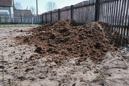 Organic fertilizer, manure piles enrich soil for high crop yield without pesticides or synthetic additives. Natural farming methods boost soil, eco-friendly harvests, and sustainable agriculture