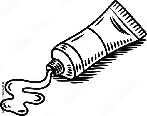 A tube of glue with adhesive dripping out onto a flat surface