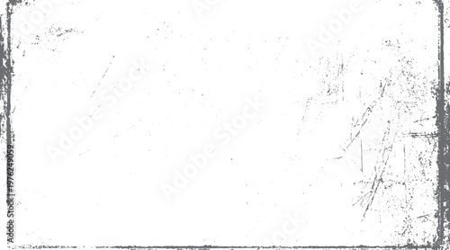 Grungy distressed textured border with scattered speckles and scratches on white background grunge