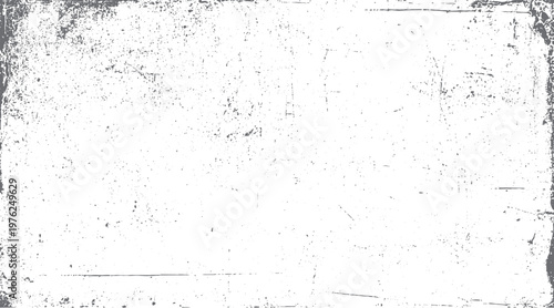 Distressed white background with scattered grey speckles and rough textured edges grunge
