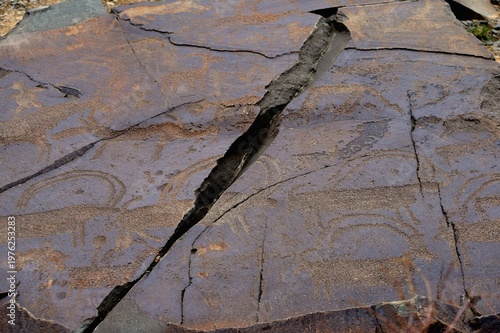 Mountain goats with unique long semicircular horns. Ancient rock carvings - Petroglyphs of Tanbaly,
Almaty Region, Zhambyl District, Matibulak Rural District District, Matibulak Rural District