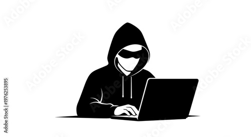 Hacker wearing a hood and glasses using a laptop for cybercrime and data theft