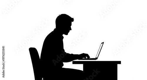 Silhouette of a Businessman Working on a Laptop at His Desk