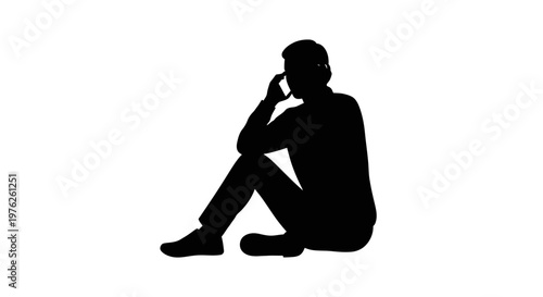 Silhouette of a Man Sitting Down Talking on a Mobile Phone Thoughtful