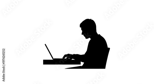 Silhouette of a Man Typing on a Laptop Computer at a Desk