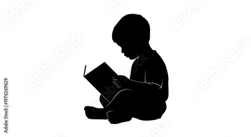 Silhouette of a Young Child Sitting and Reading an Open Book