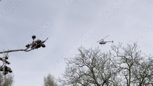 small helicopter flying around countryside